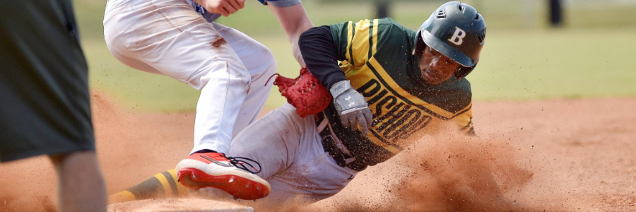 Baseball player sliding to base